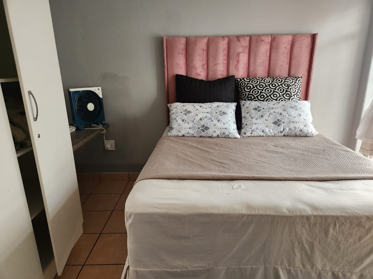 Room with sofa and sliding doors