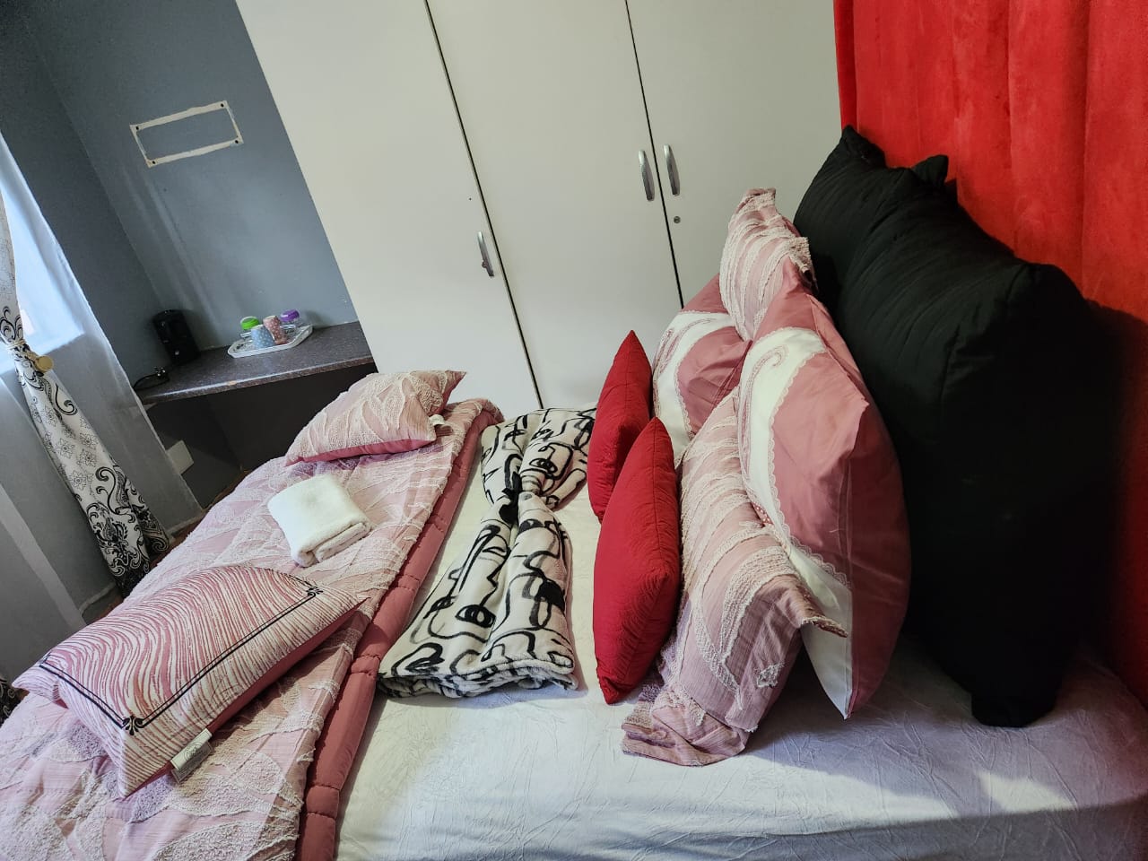 Room with neatly arranged bedding